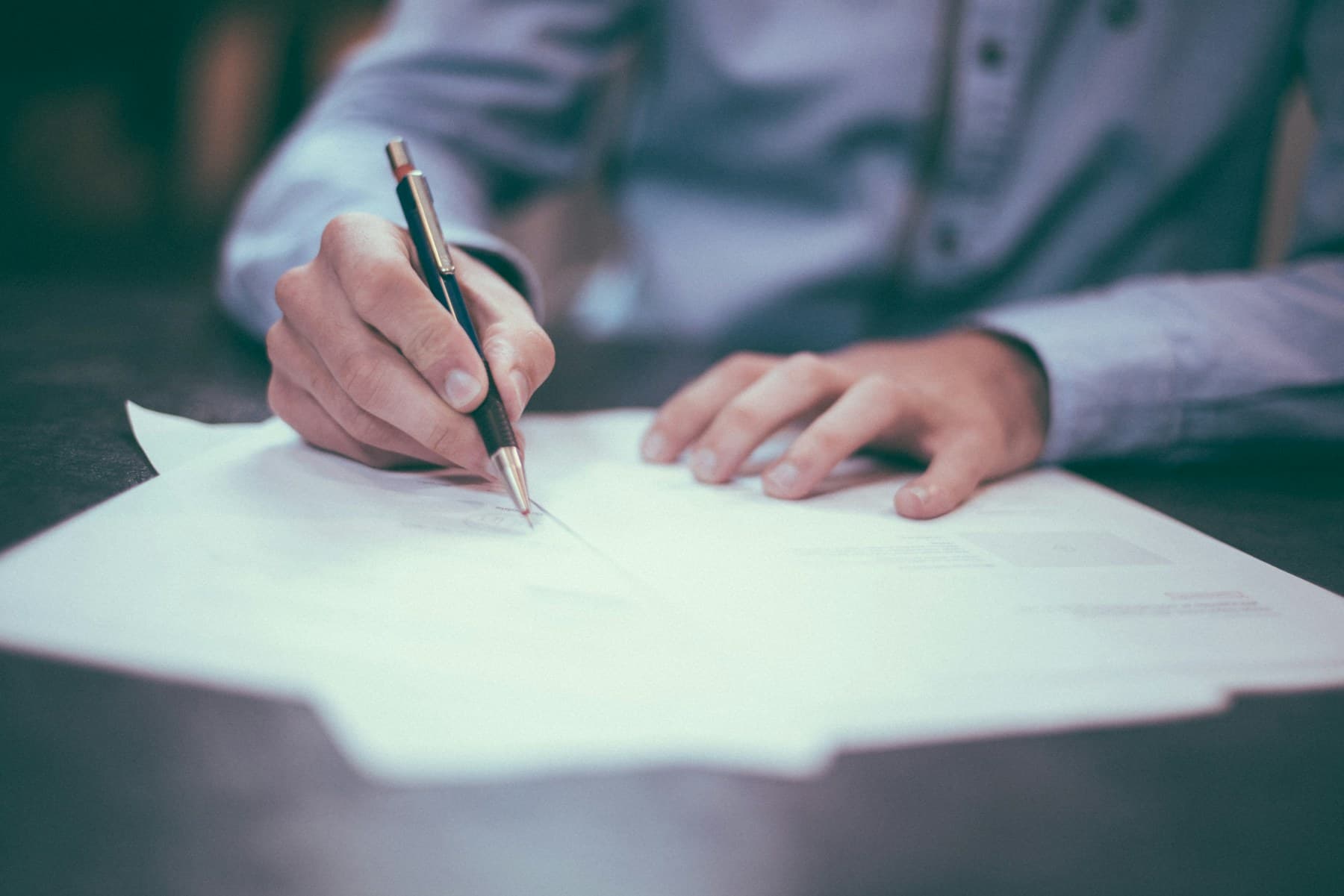 Solicitor reviewing papers at a calm professional desk