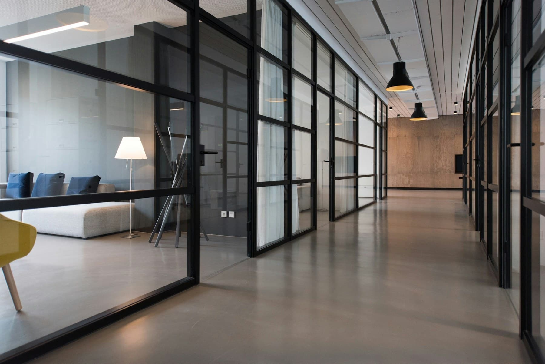 Sunlit industrial studio with flexible tables and seating