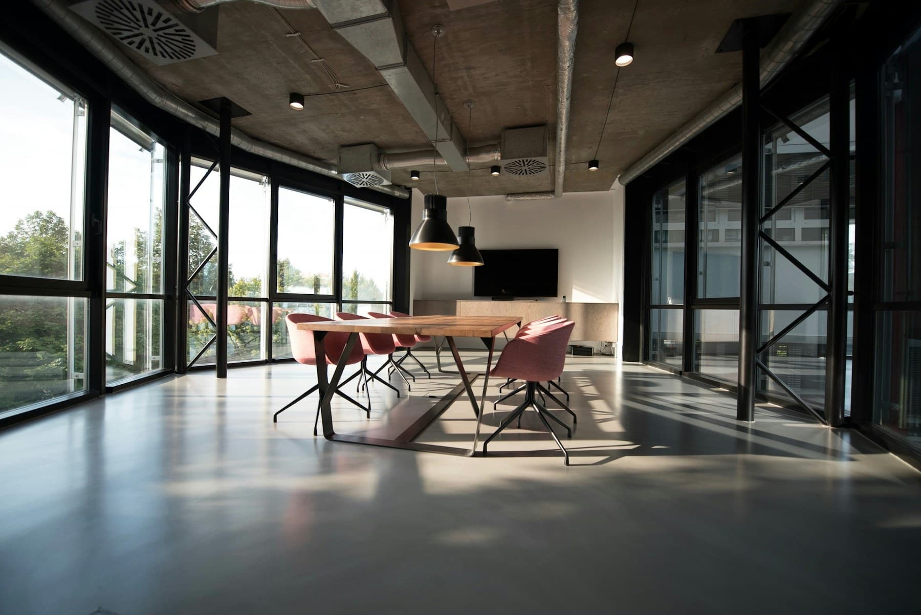 Bright creative venue with large windows and an open floor plan
